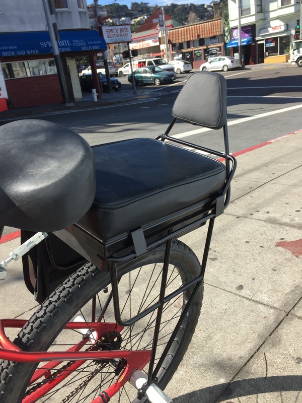 backrest prototype installed on a bike seat out on Mission St