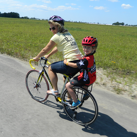 mother and son riding together on a Companion Bike Seat