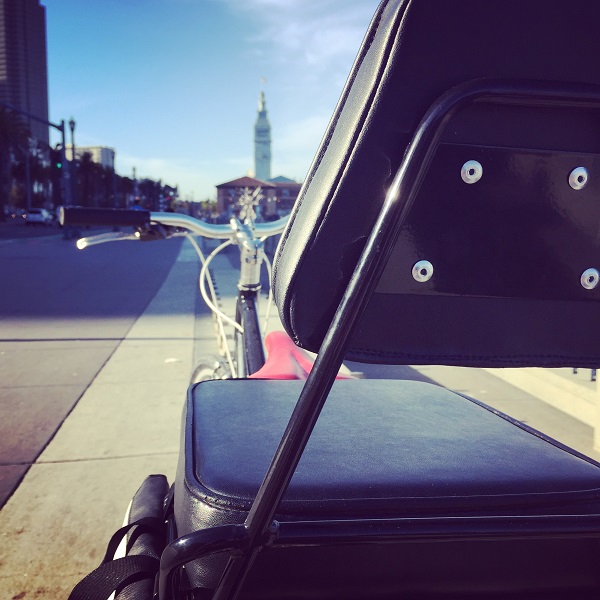the new backrest for Companion Bike Seat with the SF Ferry Building in the background