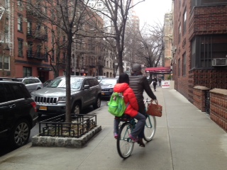 riding to school with mom on a Companion Bike Seat