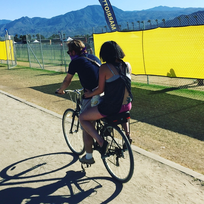 riding into Coachella Music Festival on a Companion Bike Seat