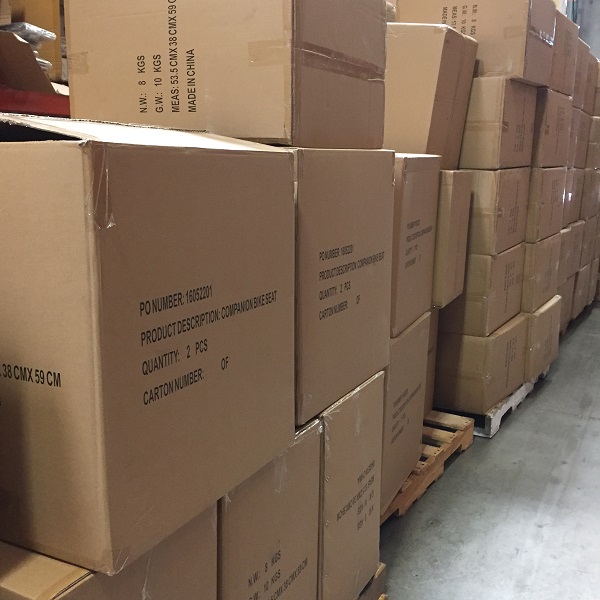boxes of Companion Bike Seats on pallets in a warehouse