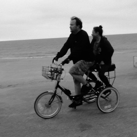 Companion Bike Seat customer photo riding on the beach in Santa Monica CA